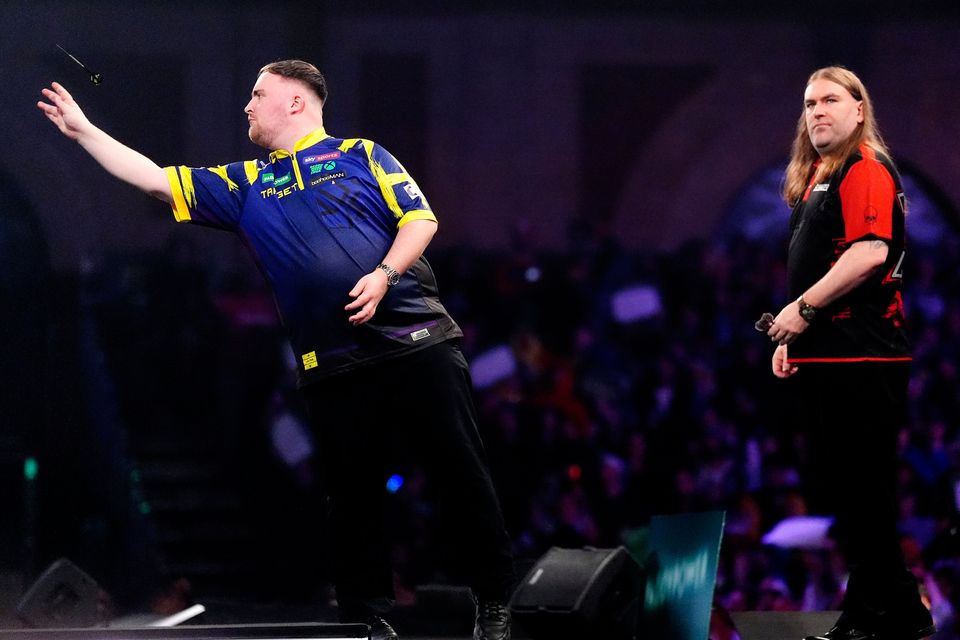 Luke Littler (left) during his match against Ryan Searle do battle at Alexandra Palace: Adam Davy/PA Wire.